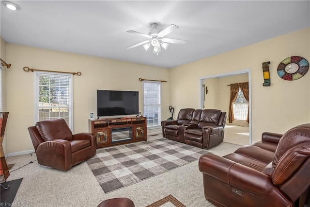 living room featuring ceiling fan and light colored carpet