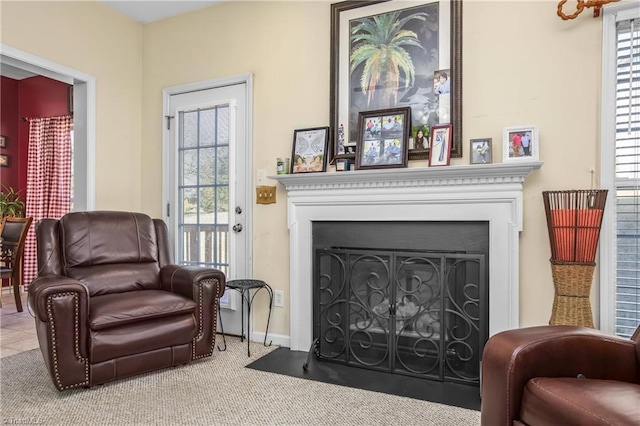 sitting room with carpet floors