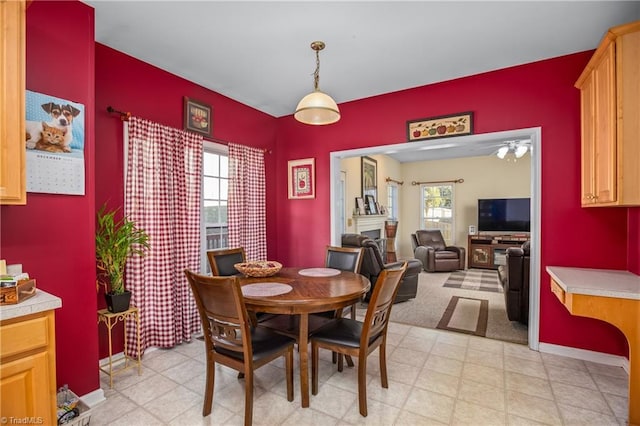 dining area featuring ceiling fan and a healthy amount of sunlight