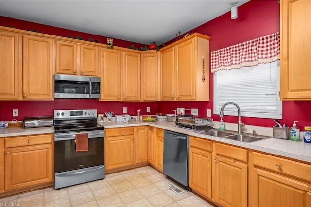 kitchen with sink and stainless steel appliances