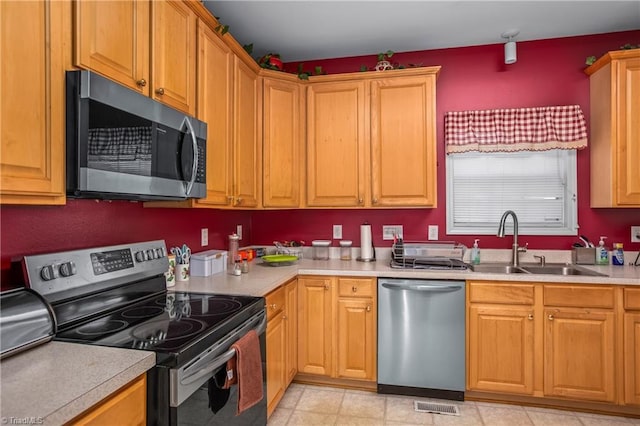 kitchen with sink and stainless steel appliances