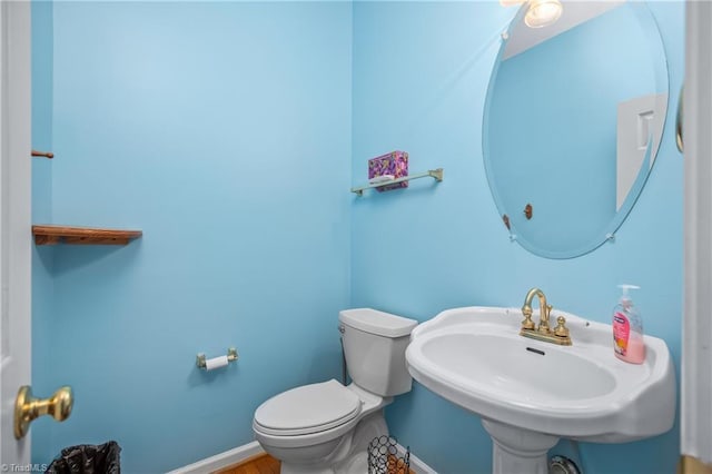 bathroom with toilet and sink