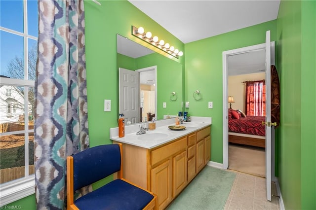 bathroom with tile patterned flooring and vanity