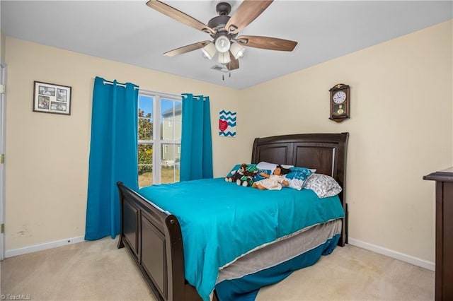 bedroom featuring light carpet and ceiling fan