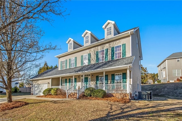 view of front facade with a garage and covered porch