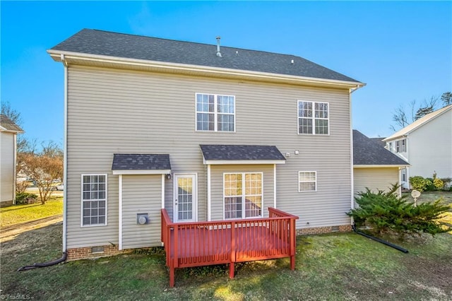 rear view of property with a yard and a wooden deck