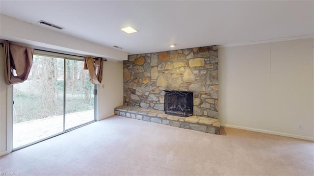 unfurnished living room featuring carpet floors and a fireplace