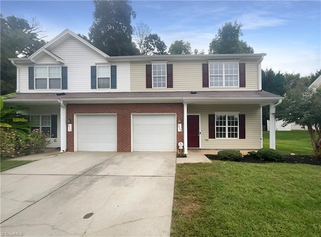 view of front of home with a garage and a front lawn