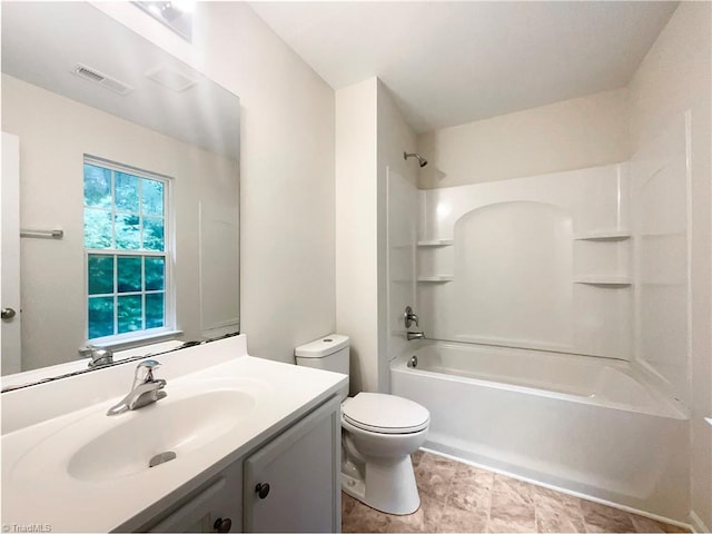 full bathroom featuring shower / tub combination, vanity, and toilet