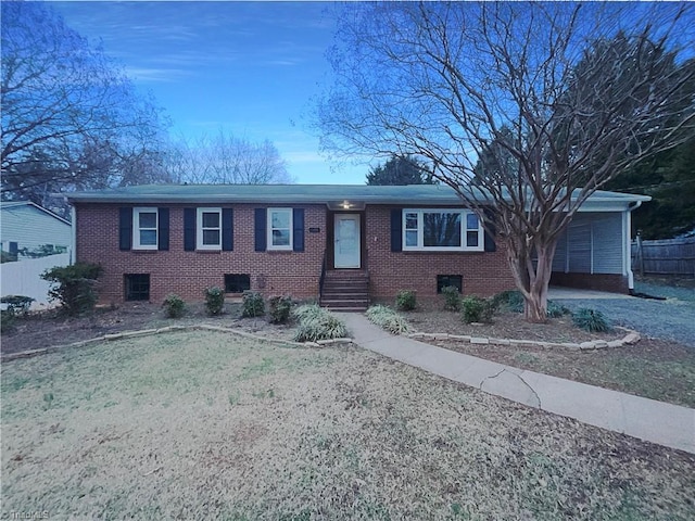 ranch-style home with brick siding and fence