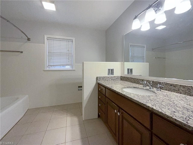 bathroom with  shower combination, tile walls, vanity, and tile patterned floors