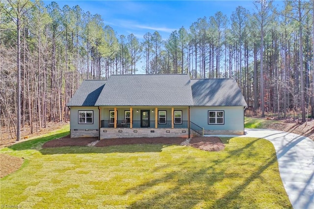 view of front of home featuring crawl space, covered porch, and a front lawn