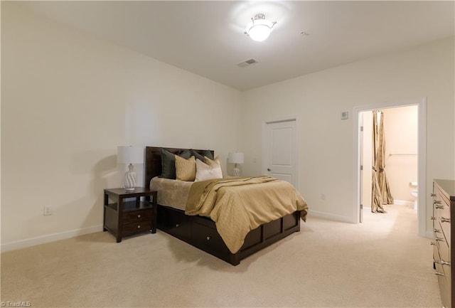 bedroom featuring baseboards, light carpet, and visible vents