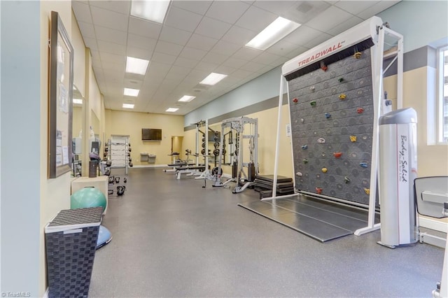 gym featuring a paneled ceiling