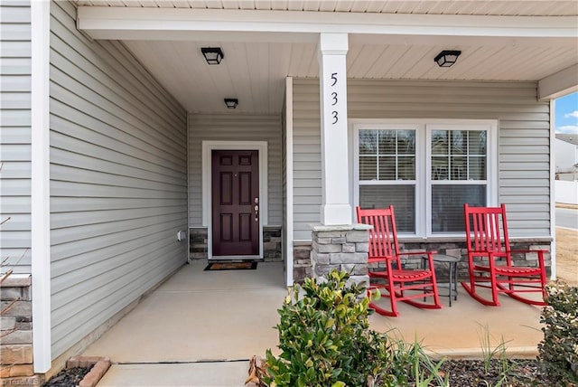 property entrance with covered porch