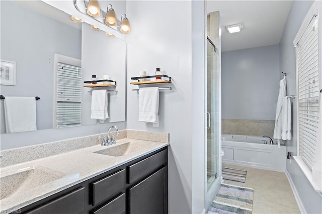 bathroom featuring vanity and independent shower and bath