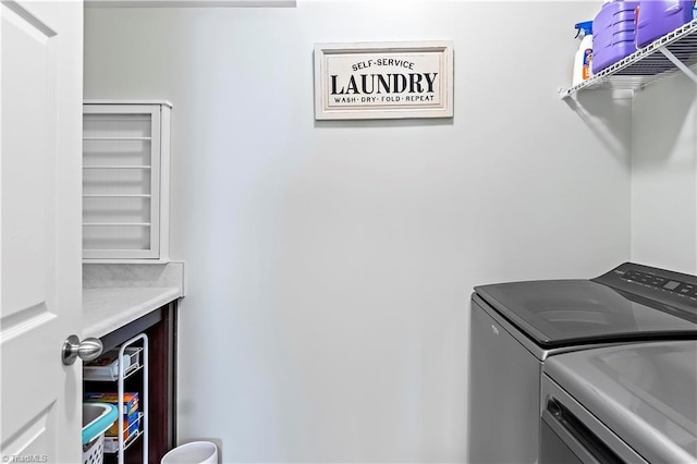 laundry area with independent washer and dryer