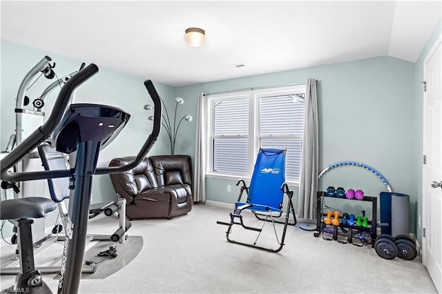 workout area with lofted ceiling and carpet