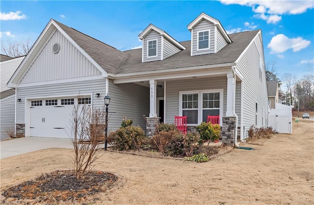 view of front of property with a garage and a porch