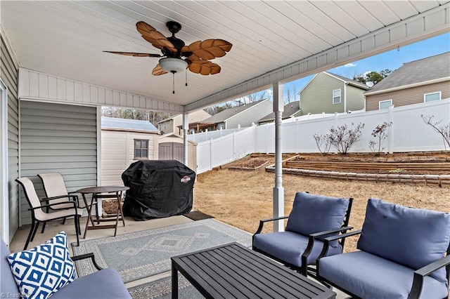 view of patio featuring ceiling fan and a grill