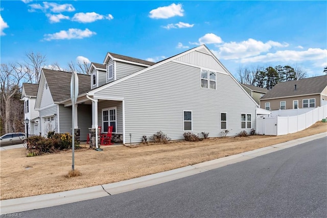 view of property exterior with a garage and a yard