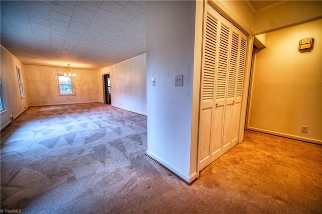 interior space with a notable chandelier, baseboards, and carpet flooring