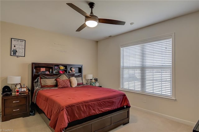 bedroom featuring ceiling fan and light colored carpet