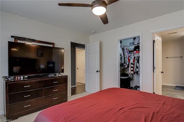 bedroom featuring a closet, ceiling fan, and a spacious closet