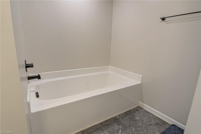 bathroom with a tub to relax in