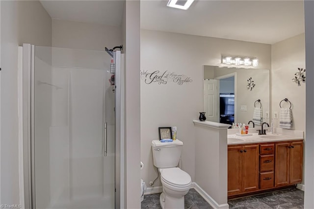 bathroom with toilet, vanity, and walk in shower