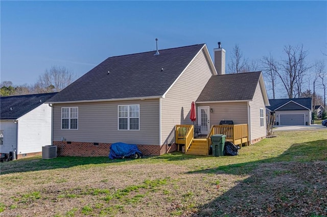 back of house featuring a deck, central air condition unit, a yard, and a garage