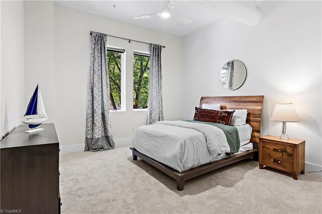 400 W 4th St Unit 305, Winston-Salem, NC 27101 - carpeted bedroom featuring baseboards and ceiling fan