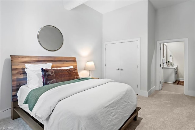 400 W 4th St Unit 305, Winston-Salem, NC 27101 - bedroom with carpet, baseboards, and ensuite bathroom