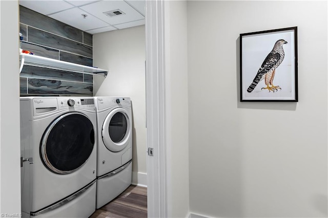 400 W 4th St Unit 305, Winston-Salem, NC 27101 - laundry room with washer and clothes dryer, wood finished floors, and baseboards
