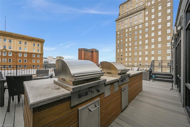 400 W 4th St Unit 305, Winston-Salem, NC 27101 - view of patio featuring a grill, an outdoor kitchen, a city view, and a balcony