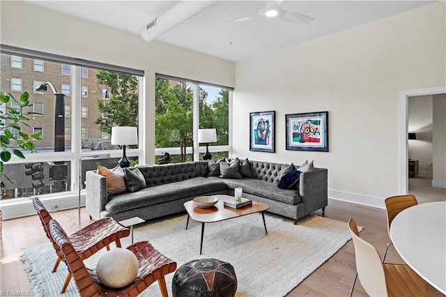 400 W 4th St Unit 305, Winston-Salem, NC 27101 - living room with a ceiling fan and baseboards
