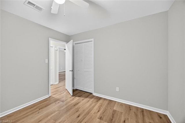 1814 Guyer St Unit A, High Point, NC 27265 - unfurnished bedroom featuring baseboards, light wood-type flooring, a closet, and a ceiling fan