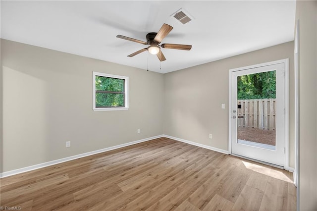 1814 Guyer St Unit A, High Point, NC 27265 - empty room with plenty of natural light, light wood-type flooring, ceiling fan, and baseboards