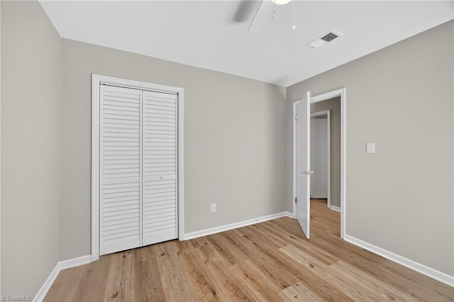 1814 Guyer St Unit A, High Point, NC 27265 - unfurnished bedroom featuring light wood-style flooring, a closet, baseboards, and ceiling fan