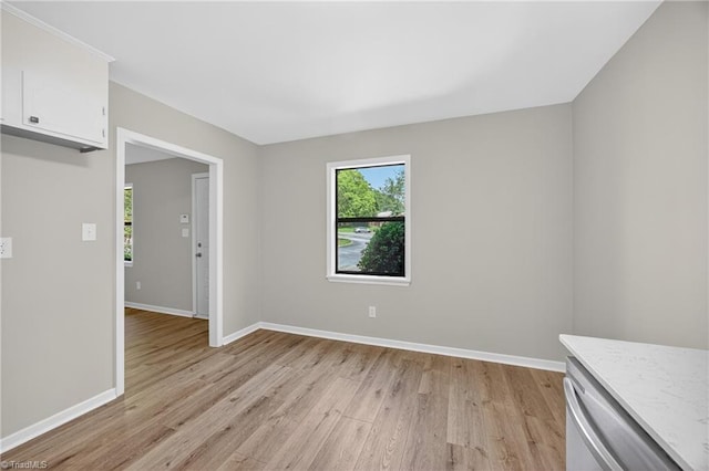 1814 Guyer St Unit A, High Point, NC 27265 - spare room featuring light wood-style floors, plenty of natural light, and baseboards