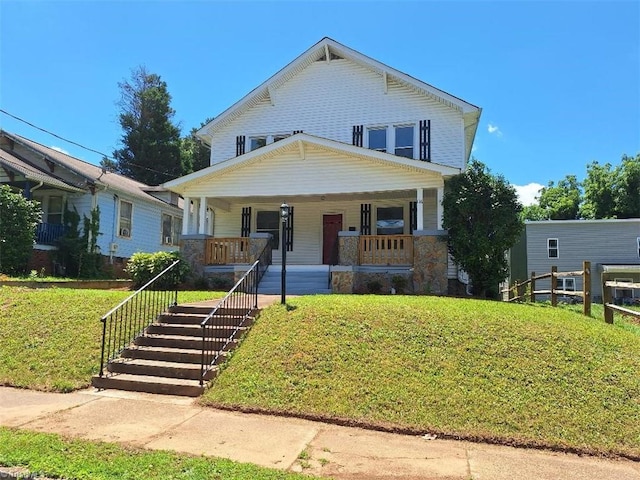 view of front of house featuring a porch and a front lawn