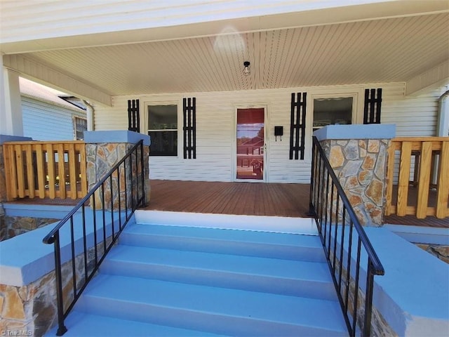 property entrance featuring covered porch