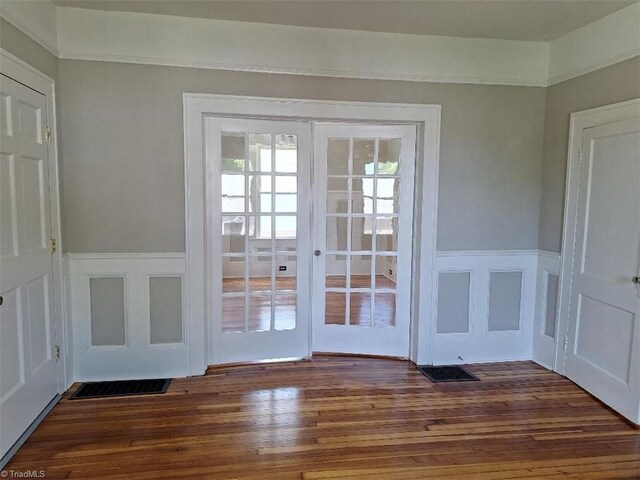 doorway to outside featuring french doors and dark hardwood / wood-style floors