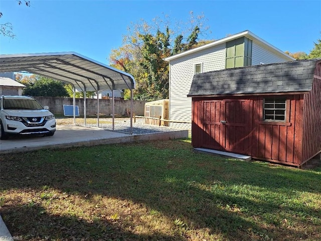 view of yard featuring a carport and a shed