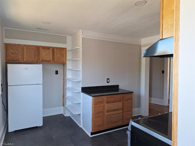 kitchen with exhaust hood, crown molding, stainless steel stove, and white refrigerator