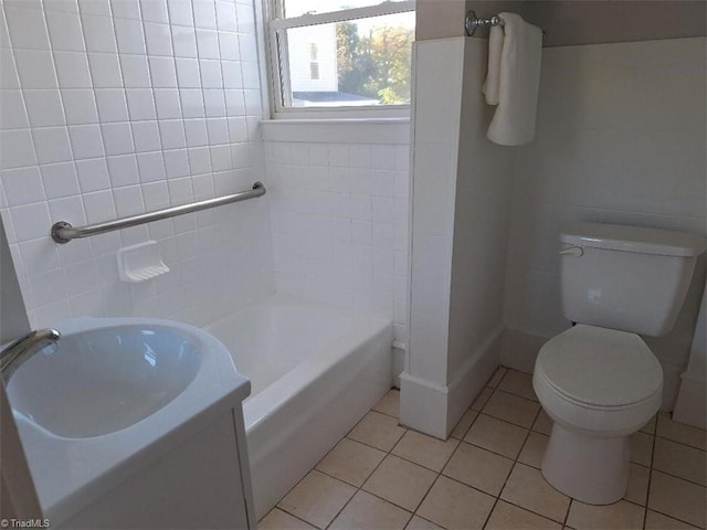 full bathroom featuring vanity, toilet, bathing tub / shower combination, and tile patterned flooring