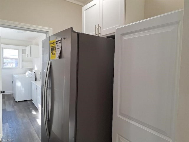 kitchen with dark hardwood / wood-style flooring, independent washer and dryer, white cabinets, and stainless steel fridge with ice dispenser