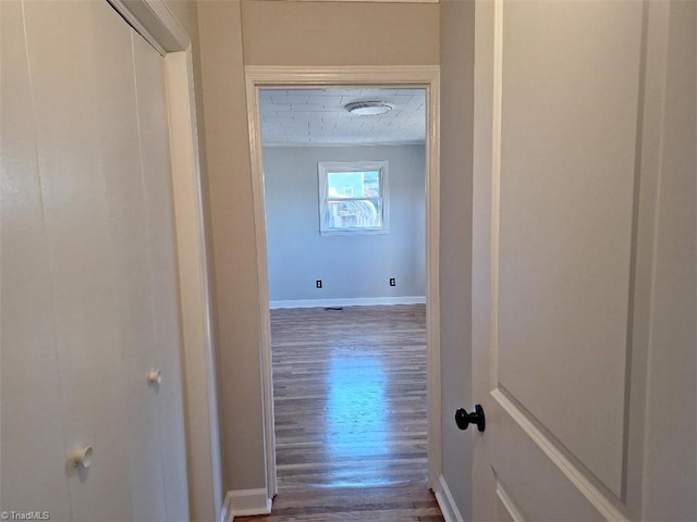 corridor with dark hardwood / wood-style floors