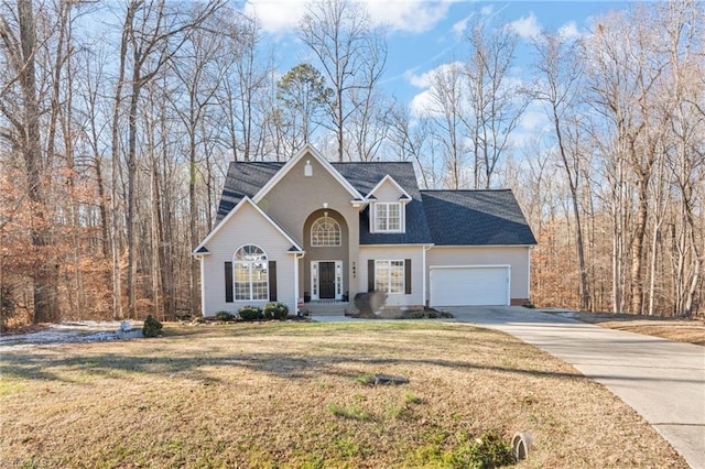 view of front property featuring a garage and a front yard