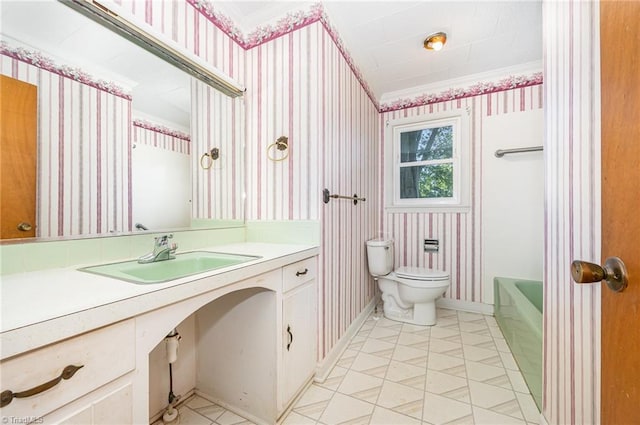 610 Frye Bridge Rd, Clemmons, NC 27012 - bathroom featuring wallpapered walls, vanity, and ornamental molding